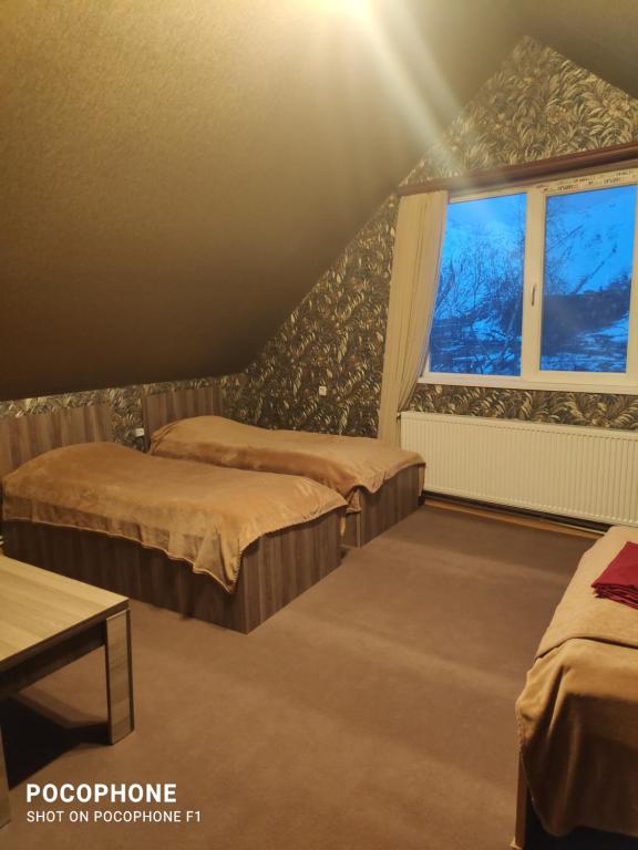 Säng eller sängar i ett rum på Green Hostel