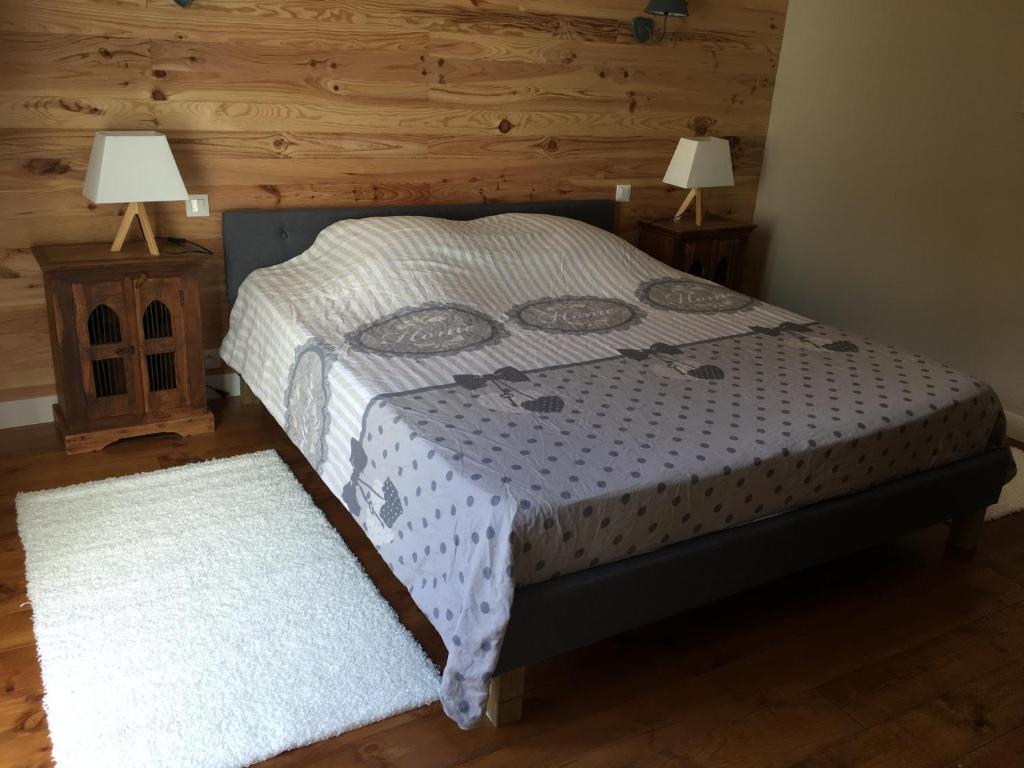 מיטה או מיטות בחדר ב-Le Gîte des Murmures
