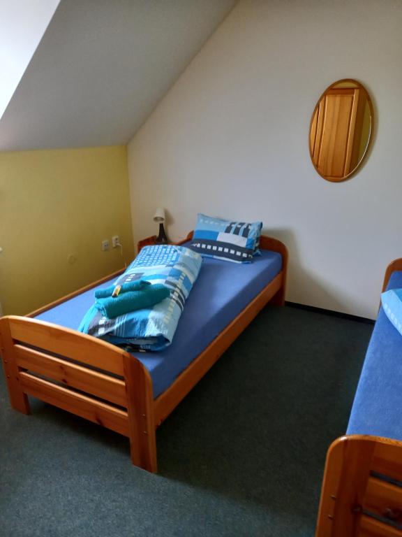 Postel nebo postele na pokoji v ubytování Hotel Nové Údolí