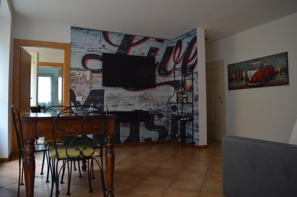 a living room with a wall with a tv on it at Da Sid in Tremezzo