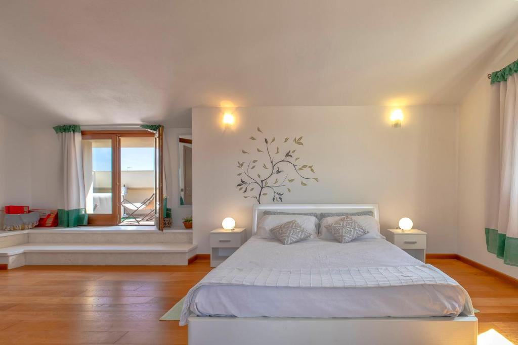 Posteľ alebo postele v izbe v ubytovaní Sardinia Guest House