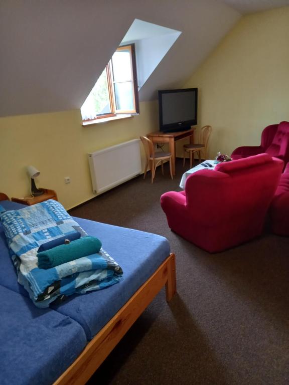 Postel nebo postele na pokoji v ubytování Hotel Nové Údolí