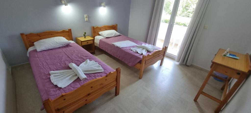 Postel nebo postele na pokoji v ubytování Corfu-Apartments4you
