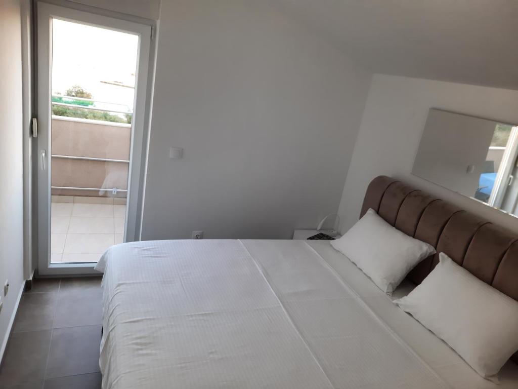 Postel nebo postele na pokoji v ubytování Apartman Hanna