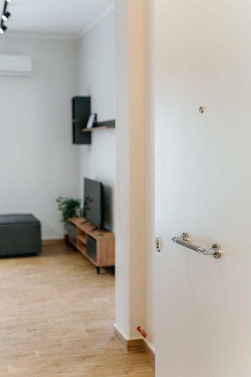 Televízia a/alebo spoločenská miestnosť v ubytovaní STAMATINA'S LUXURY APARTMENTS (DELUXE SUITE)