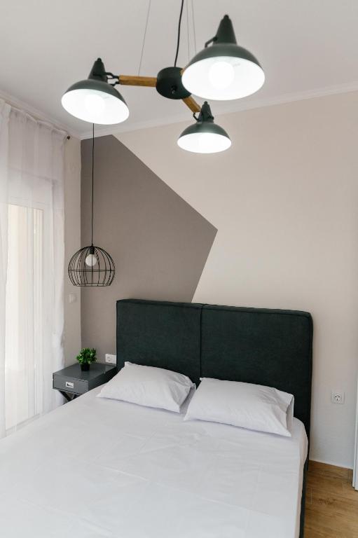 Posteľ alebo postele v izbe v ubytovaní STAMATINA'S LUXURY APARTMENTS (DELUXE SUITE)