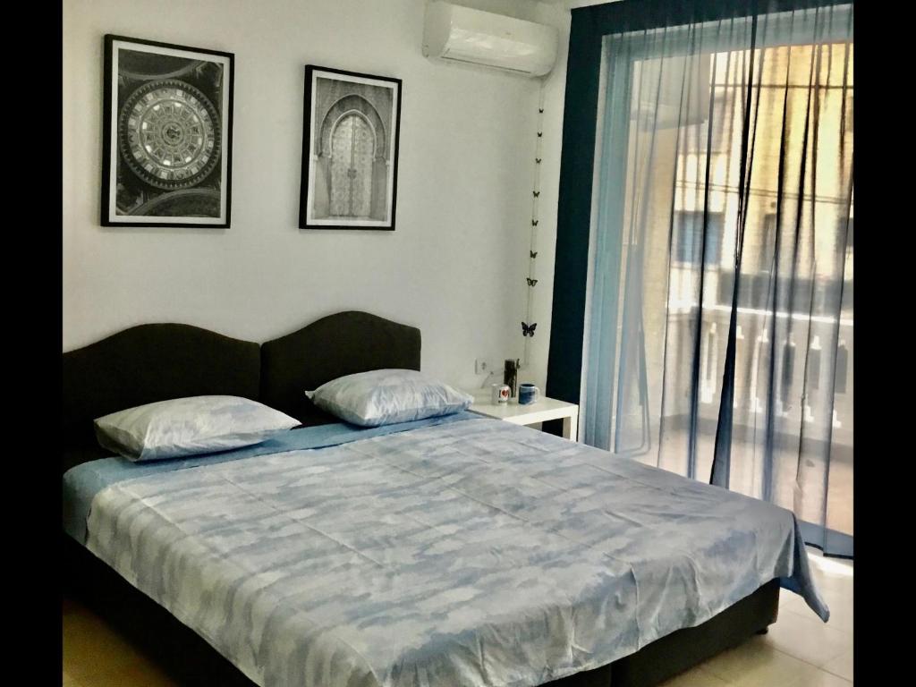 Postel nebo postele na pokoji v ubytování DK Apartmani
