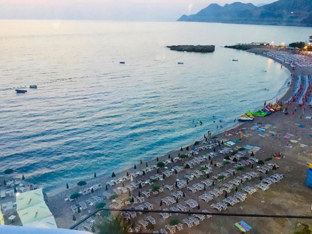 an aerial view of a beach with a crowd of people at DK Apartmani in Dobra Voda