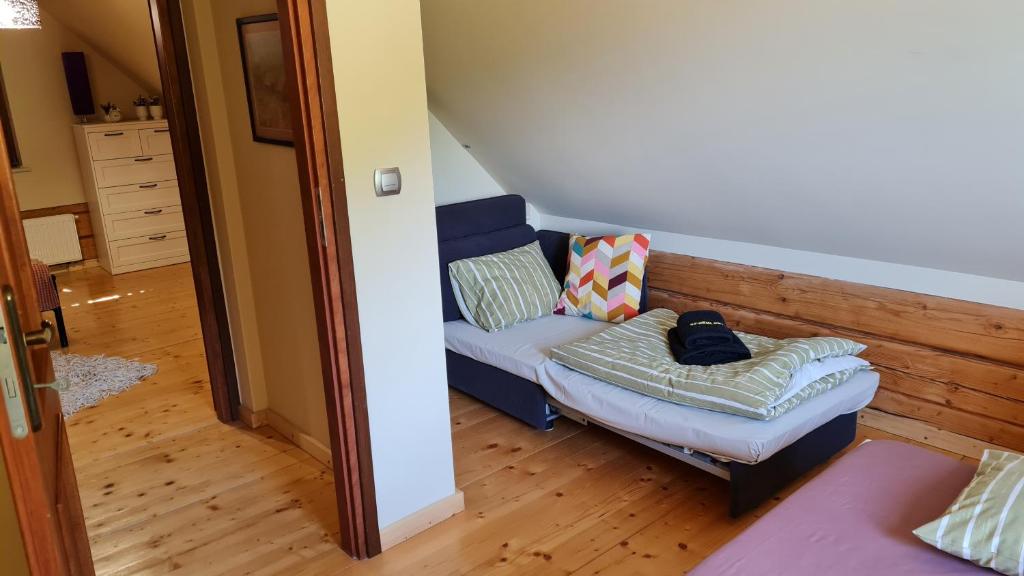 Posteľ alebo postele v izbe v ubytovaní Apartamenty SPOKOLOKO Letniczówka Widoki