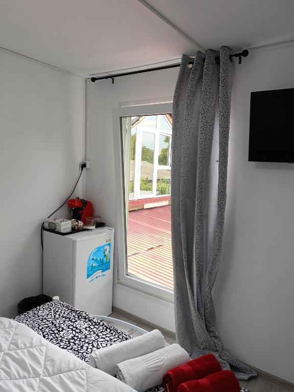 Postel nebo postele na pokoji v ubytování AMBIENT Geavidan 2