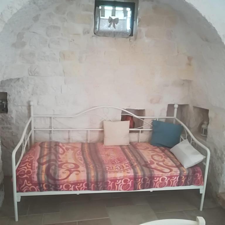 Posteľ alebo postele v izbe v ubytovaní Trulli Manuela (il fragno)