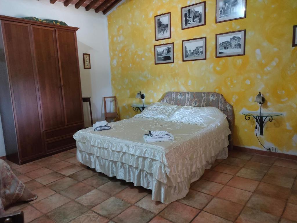 Postel nebo postele na pokoji v ubytování Bio Agriturismo Il Cavone