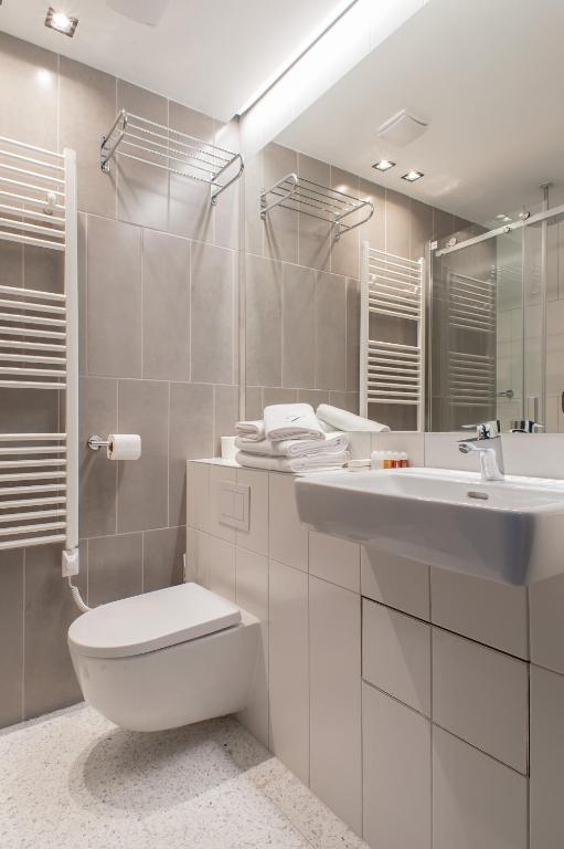 a bathroom with a toilet and a sink at Boutique hotel Lili in Rovinj