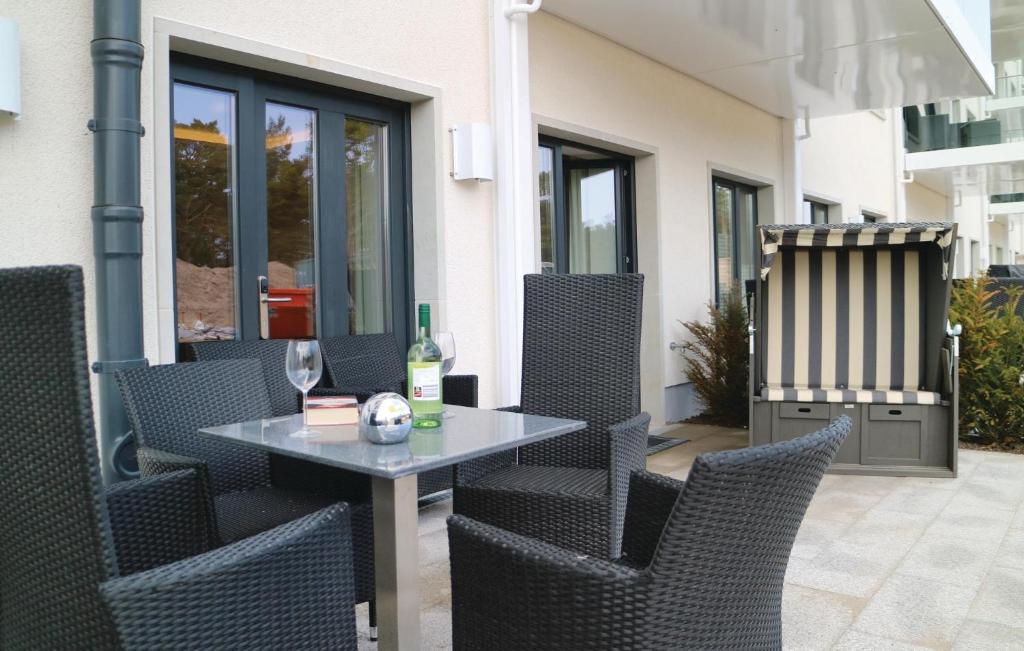 a table and chairs sitting on a patio at Moon in Binz