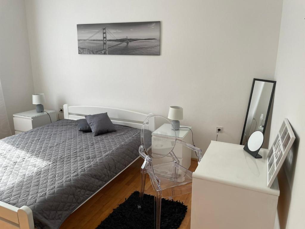 Postel nebo postele na pokoji v ubytování Apartment Greta