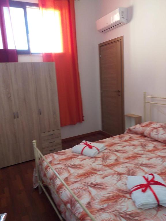 Posteľ alebo postele v izbe v ubytovaní L'Albero bello Holiday