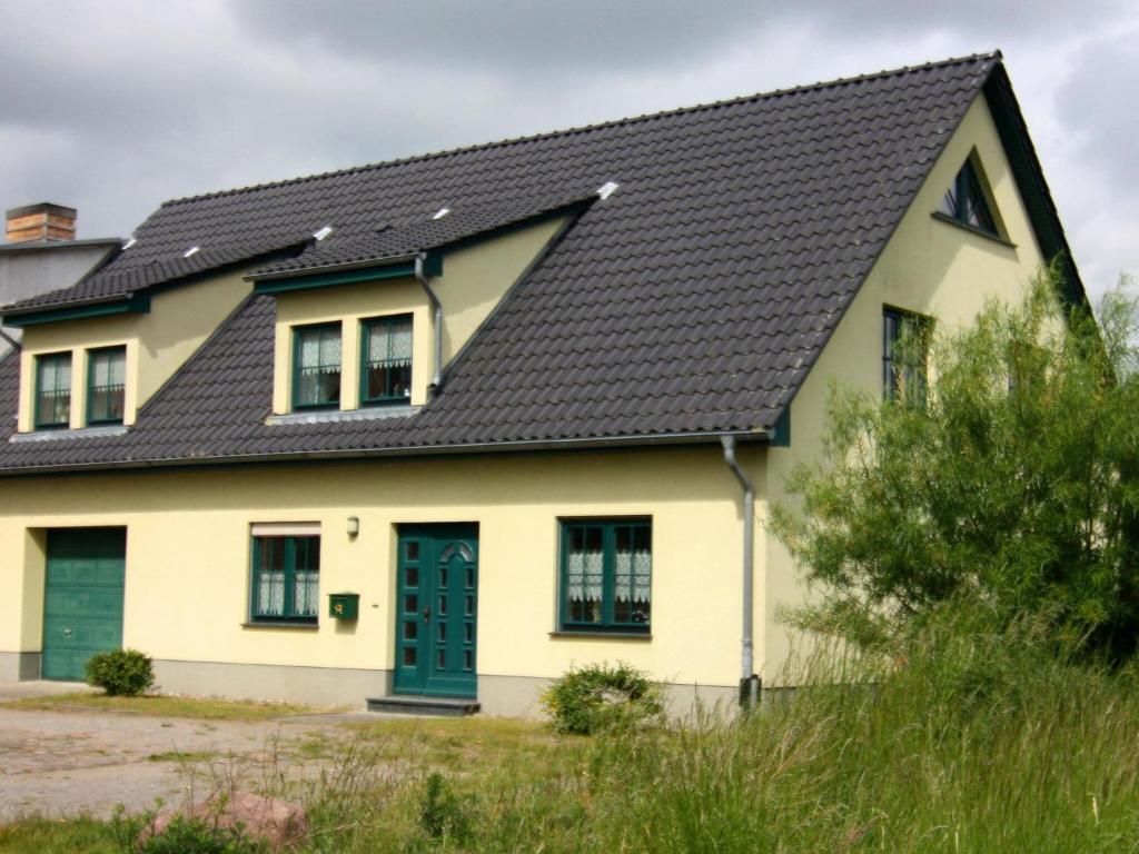 a house with a black roof at Apartment at the Castle Square in Wolgast
