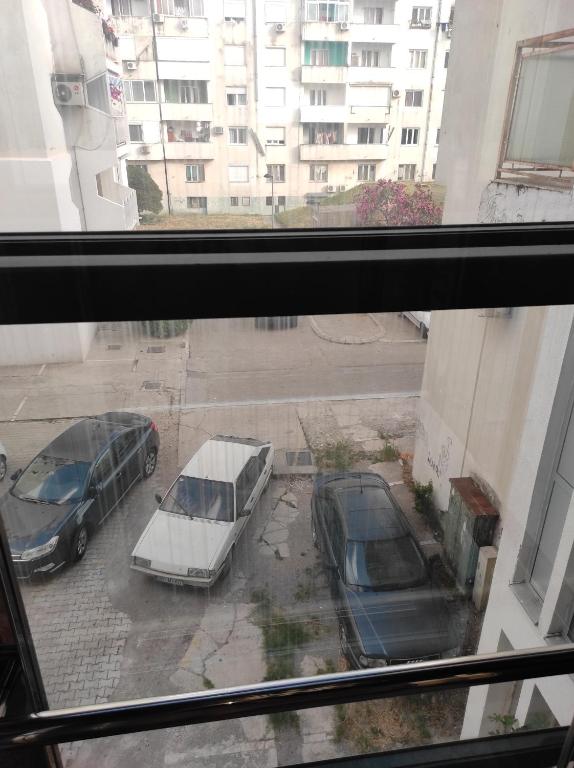 a view of two cars parked in a parking lot at Apartman Centar Bar in Bar