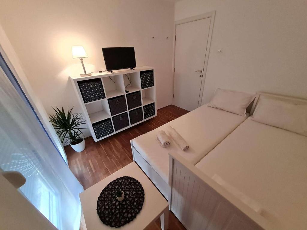 Posteľ alebo postele v izbe v ubytovaní Apartmani Lovre i Zara