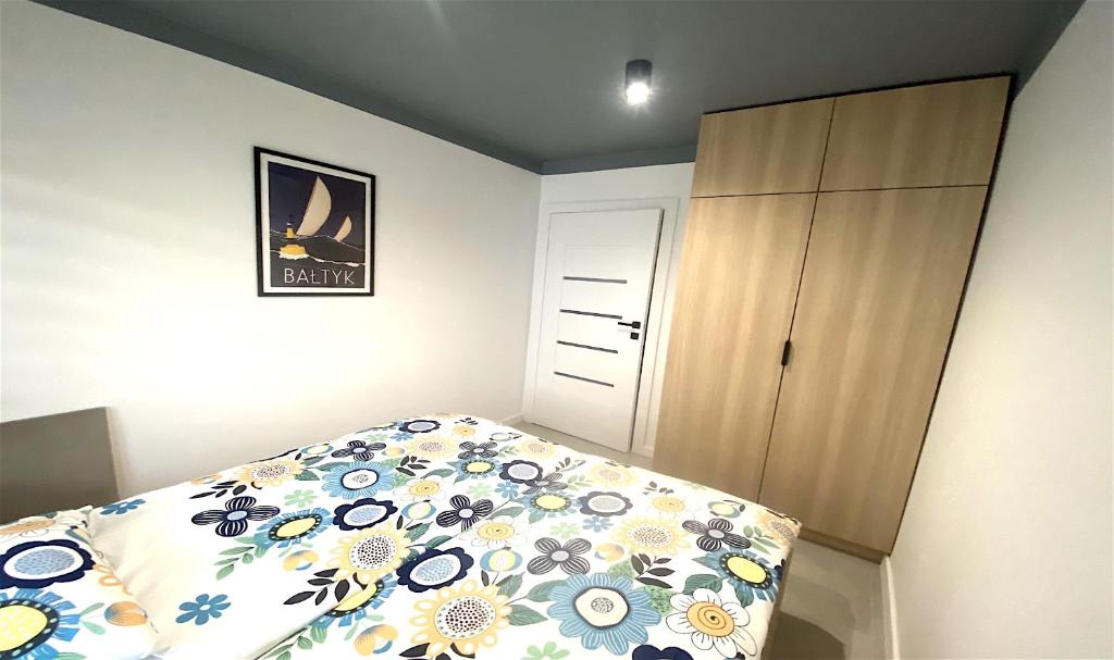 Posteľ alebo postele v izbe v ubytovaní Apartamenty Marea Rentals Bałtyk Ustka