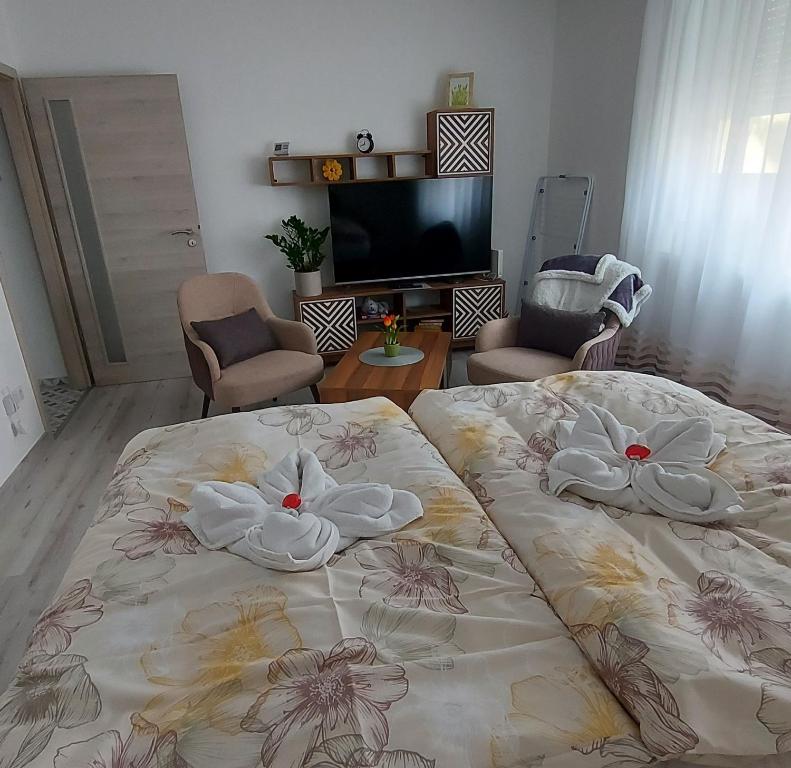 Postel nebo postele na pokoji v ubytování Pitypang Apartman