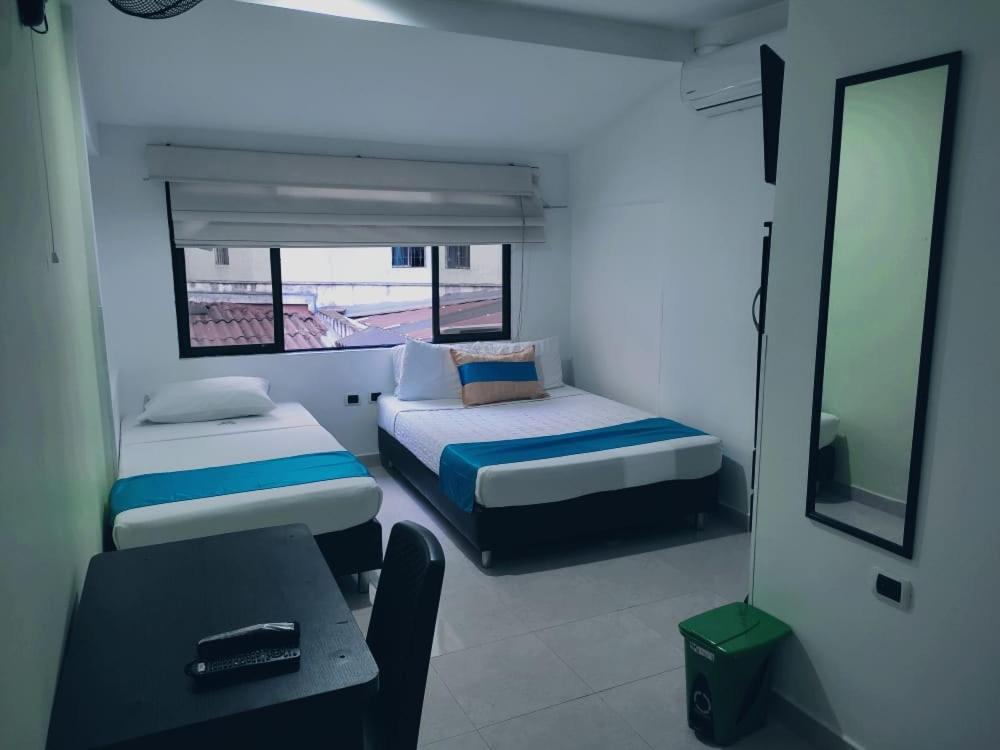 En eller flere senger på et rom på HOTEL VILLAMAYOR CABECERA