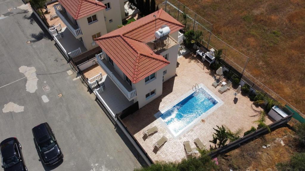 an overhead view of a house with a swimming pool at Villa Oceania in Ayia Napa