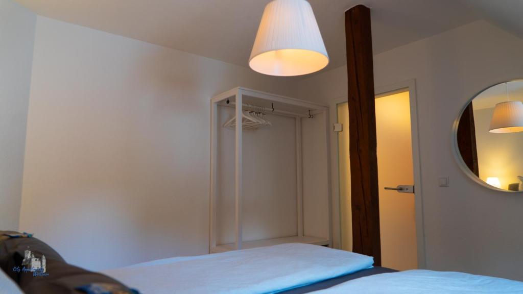 Una cama o camas en una habitación de City Apartment Wertheim