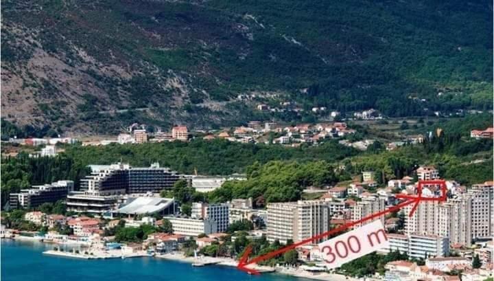 an aerial view of a city next to the water at Privatan smeštaj Igalo in Igalo