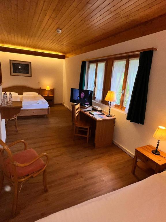 Postel nebo postele na pokoji v ubytování Hotel Roc et Neige