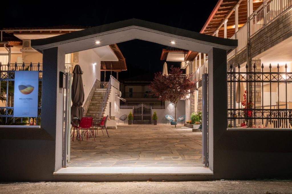 an open door to a patio at night at Bella Terra Nature Living in Asprovalta