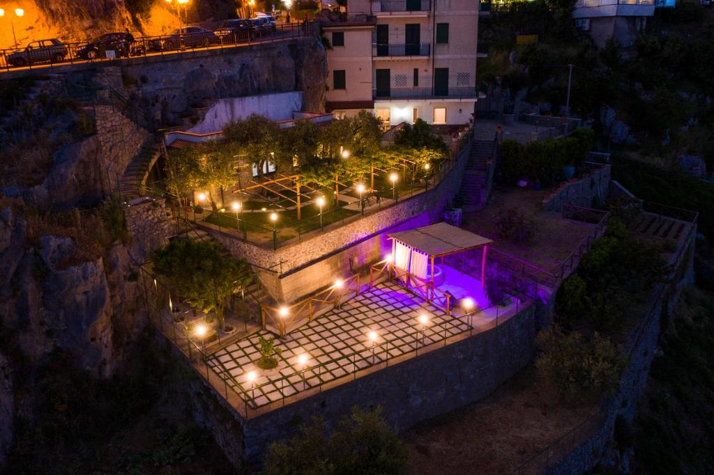 an overhead view of a park with lights at night at Apartments PARADISE GARDEN Holiday House in Agerola