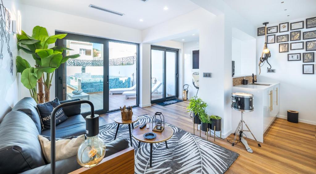 a living room with a couch and a table at Medusa Luxury Marina in Vilamoura