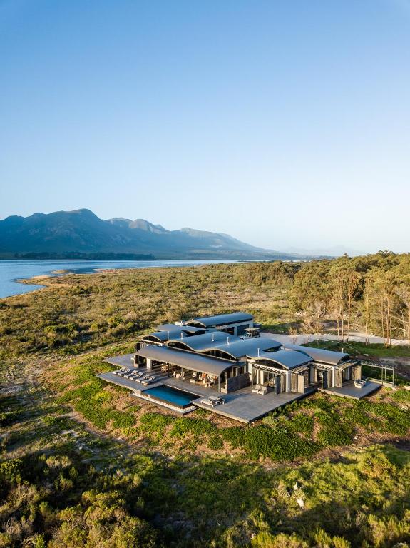 an aerial view of a building on the side of a lake at Perivoli Lagoon House in Stanford