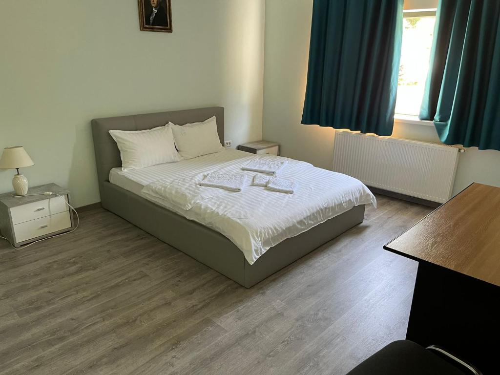 Postel nebo postele na pokoji v ubytování VILA SARA