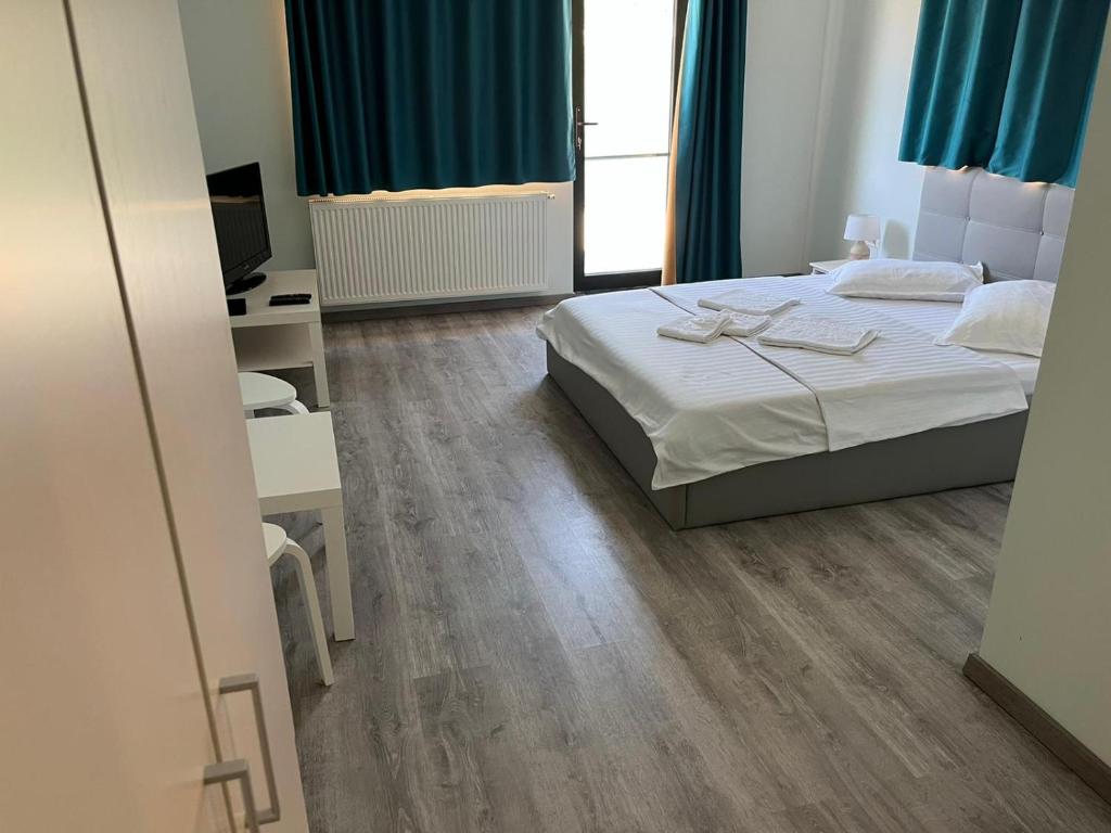 Postel nebo postele na pokoji v ubytování VILA SARA