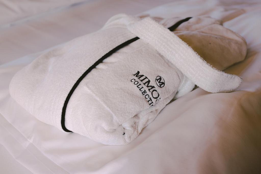 Postel nebo postele na pokoji v ubytování Mimosa Suites