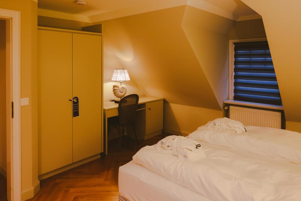 Postel nebo postele na pokoji v ubytování Mimosa House