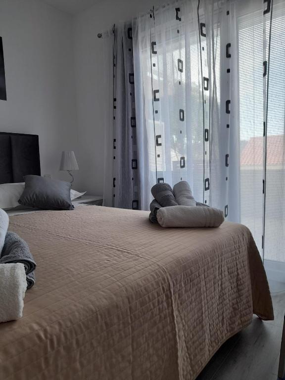 Posteľ alebo postele v izbe v ubytovaní Apartman Lucy