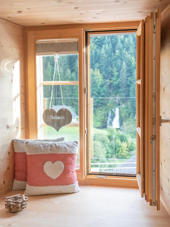 Postel nebo postele na pokoji v ubytování Hotel Wasserfall