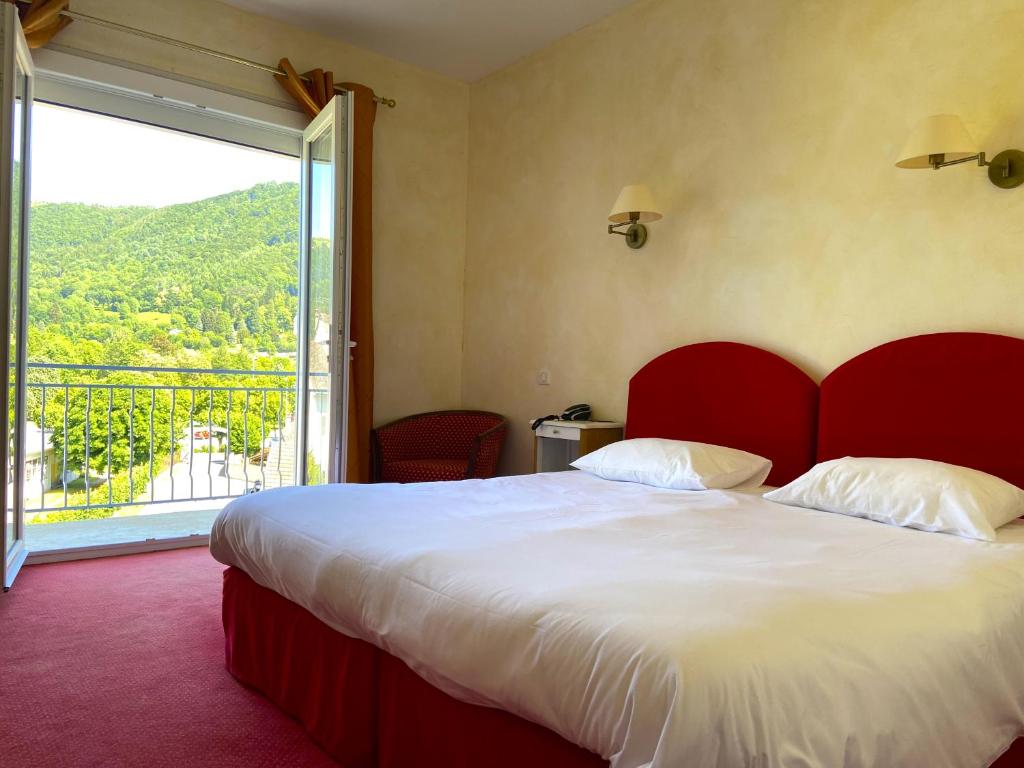 Katil atau katil-katil dalam bilik di Hotel Beauséjour