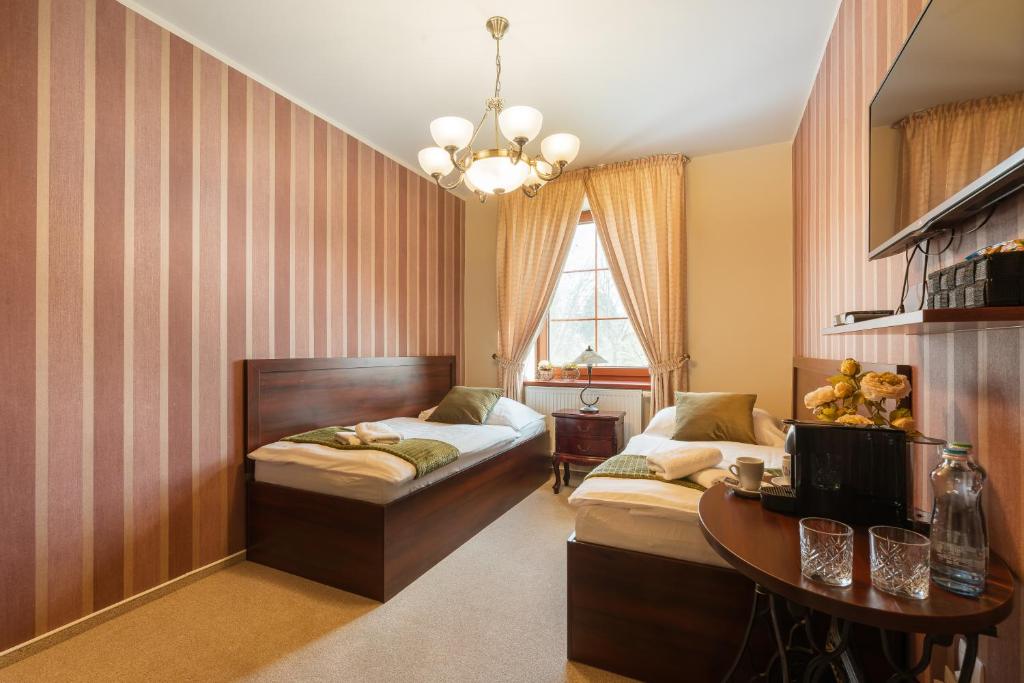 Postel nebo postele na pokoji v ubytování Hotel Plumlov