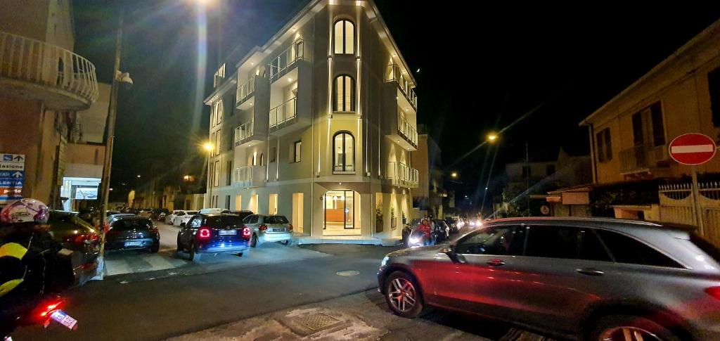 a car parked in front of a building at night at Solmaris Tropea Rooms & Suites in Tropea