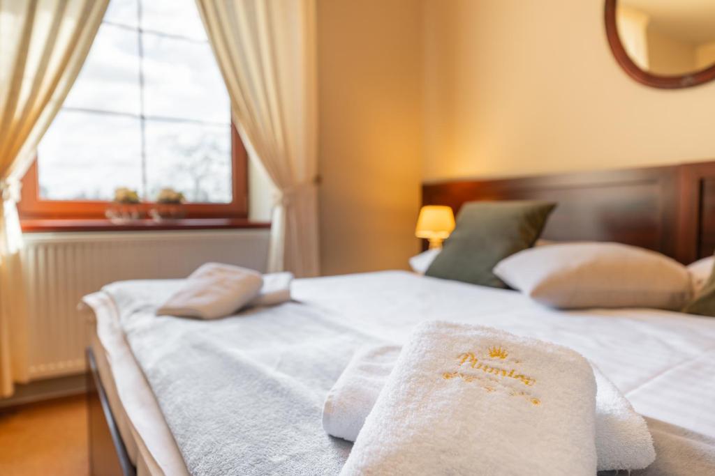 Postel nebo postele na pokoji v ubytování Hotel Plumlov