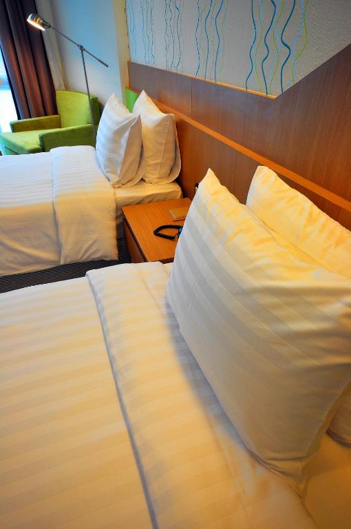 Postel nebo postele na pokoji v ubytování 42C The Chic Hotel