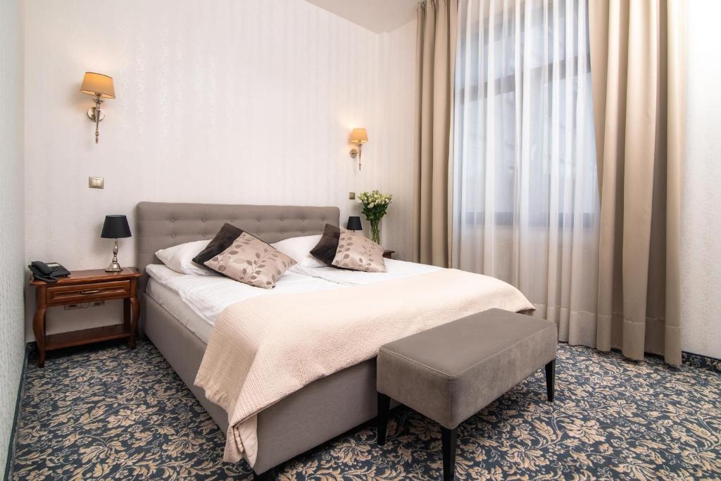 Voodi või voodid majutusasutuse Hotel Park Kajetany toas
