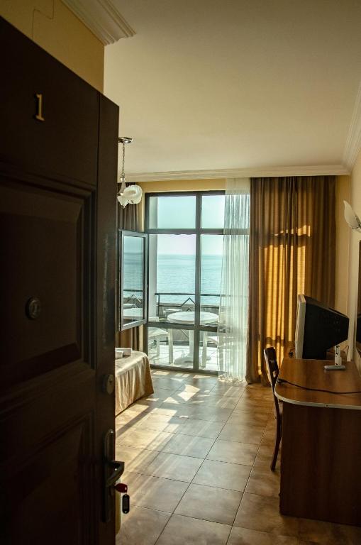 TV a/nebo společenská místnost v ubytování Hotel Medusa