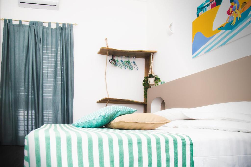 Postel nebo postele na pokoji v ubytování Homiday - Bel Salento Specchia Guest house