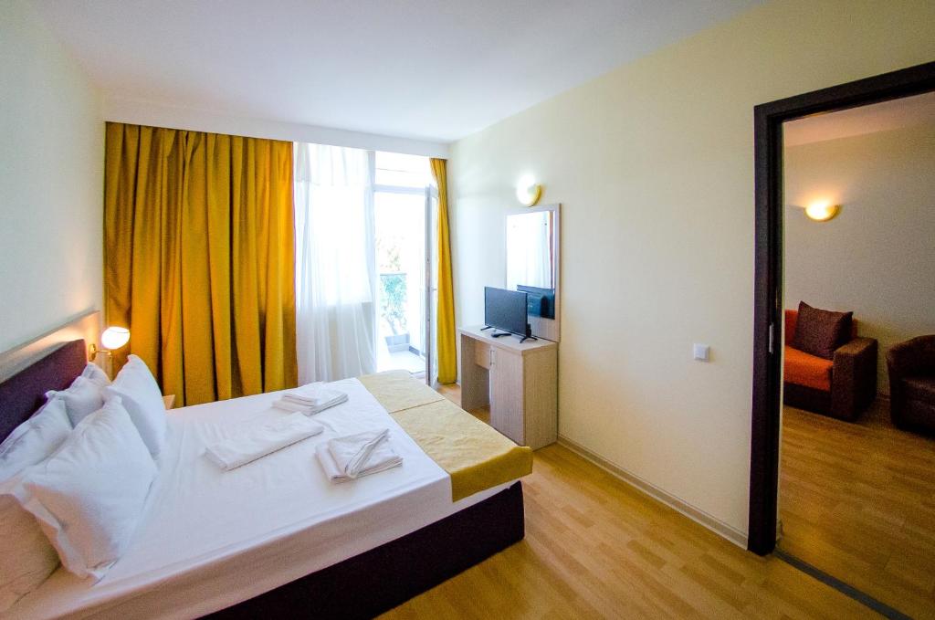 Postel nebo postele na pokoji v ubytování Hotel Apollo
