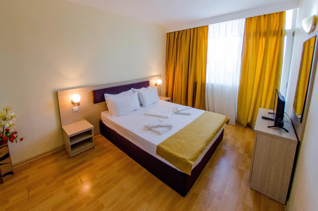 Postel nebo postele na pokoji v ubytování Hotel Apollo